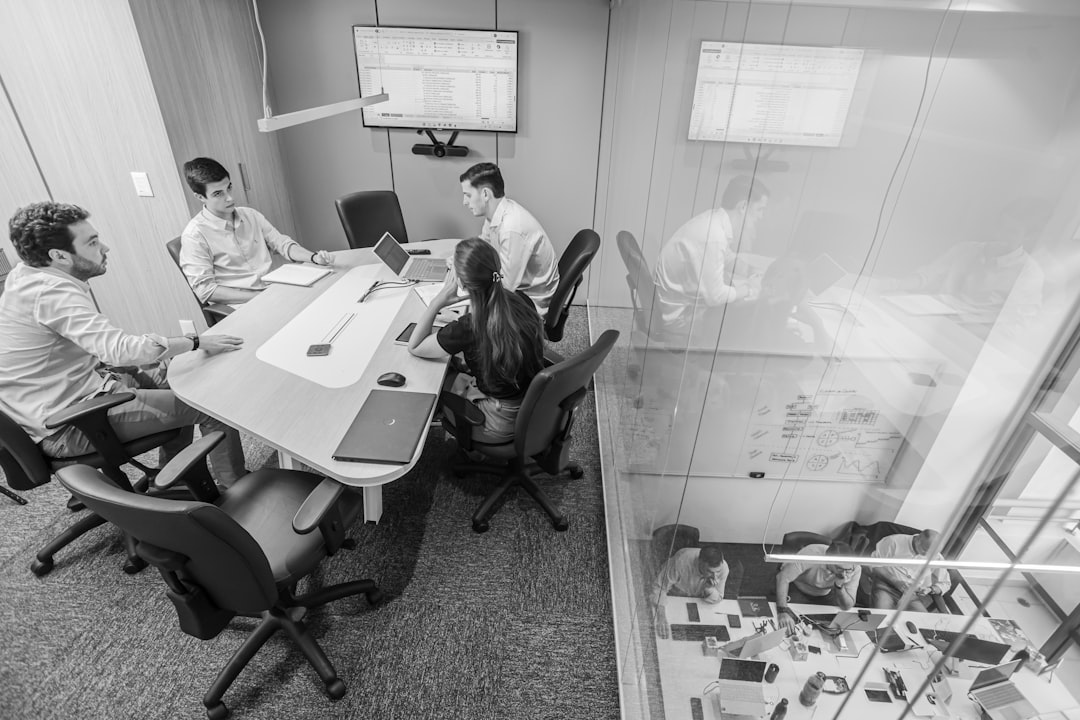 Team meeting in modern conference room discussing strategy